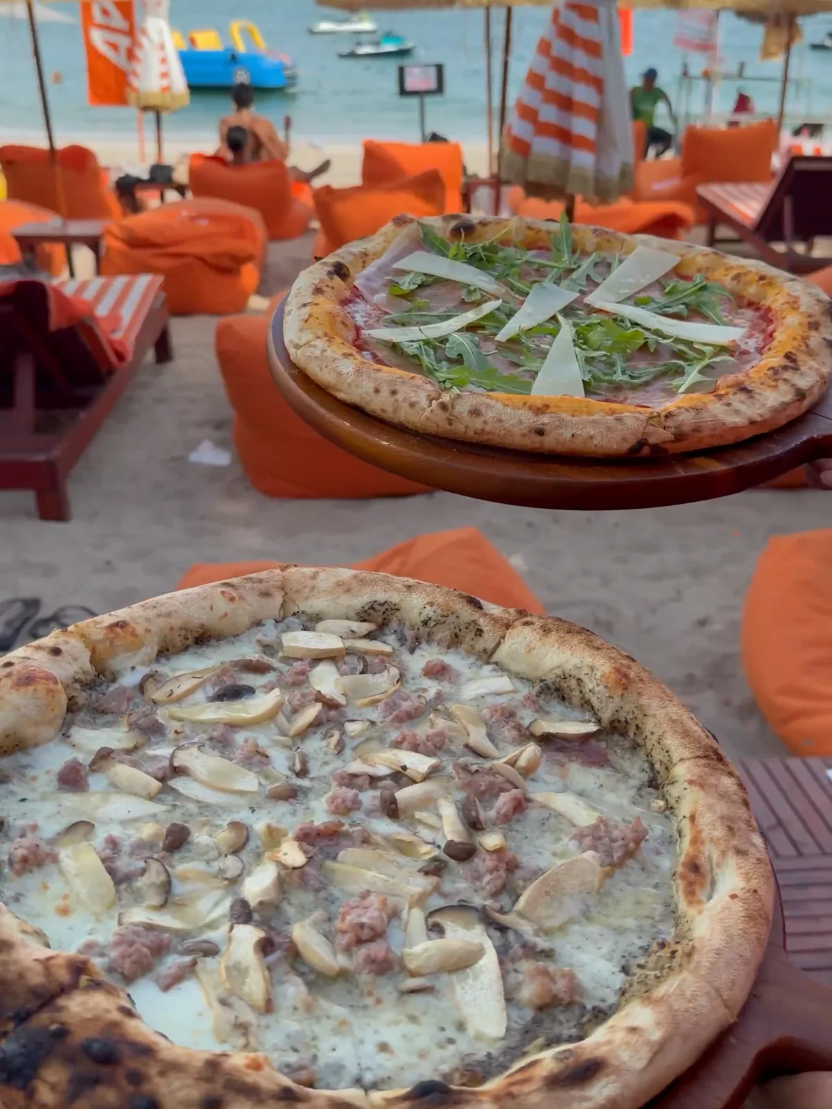 Pizzas served on the sunbeds at Brio Beach